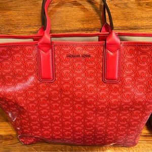 Red Michael Kors bag with purse organizer